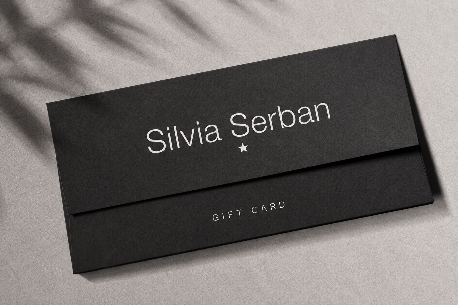 Silvia Șerban gift card in a black envelope